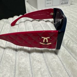 Brand new authentic Chanel sunglasses with original box. Pink and navy blue